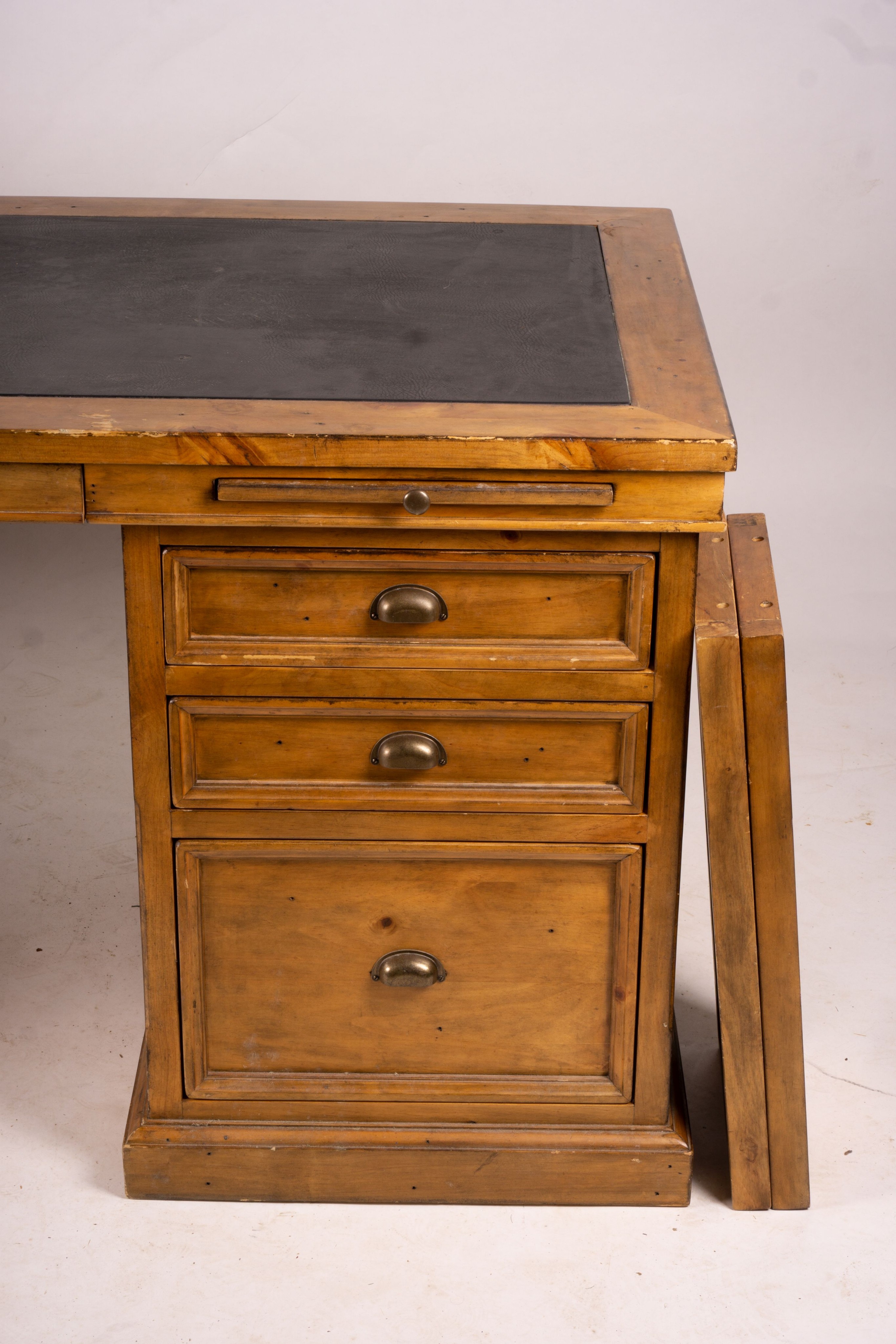 A reproduction pine kneehole desk, width 174cm, depth 79cm, height 86cm together with a matching pine three drawer filing cabinet